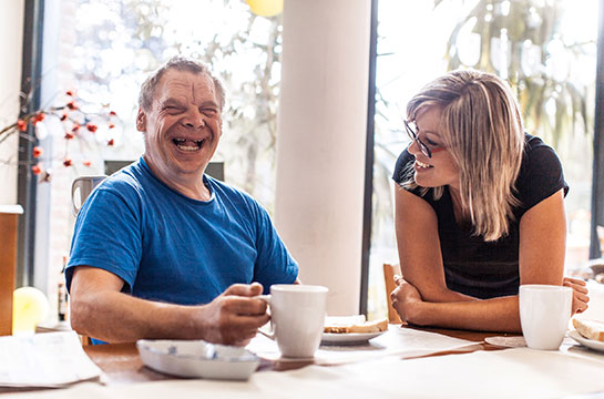 Carer and client laughing